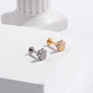 G23 titanium labret stud with golden and silver claw design and clear zircon inlay