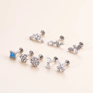 Titanium labret studs with butterfly and bat shapes featuring clear zircon and opal