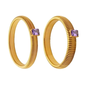 Golden textured hoop earrings with square purple zircon stone inlay in 45-degree view