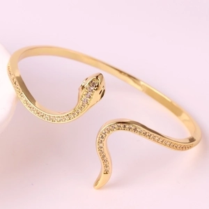 Elegant gold snake head open bracelet with crystals and minimalist luxury design