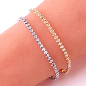 Classic gold and silver teardrop zircon tennis bracelet set on a model wrist
