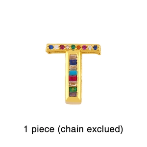 Detailed view of gold T-letter pendant charm with colorful inlaid zircon gemstones