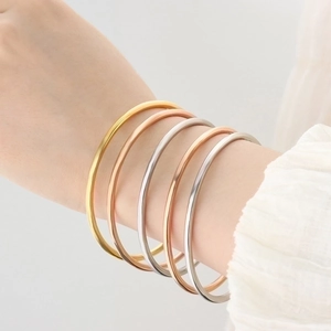 Set of five minimalist titanium steel thin bangles in gold, rose gold and silver