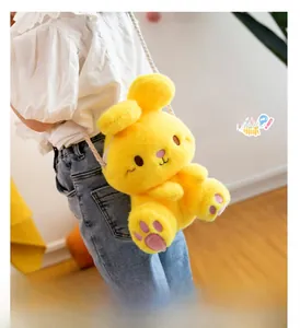 Detailed texture of yellow plush rabbit crossbody bag with braided white cotton strap