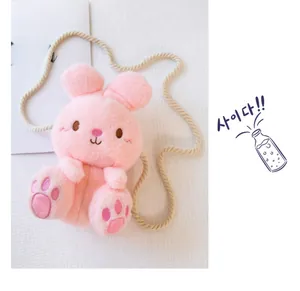 Detailed close-up of a pink plush bunny bag for children with soft texture and embroidery