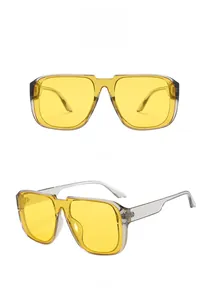 Front and side views of oversized gray pilot sunglasses with vibrant yellow lenses