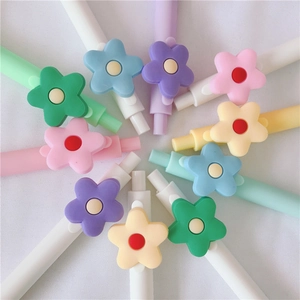Set of colorful cartoon floral retractable gel pens with flower toppers in vibrant colors