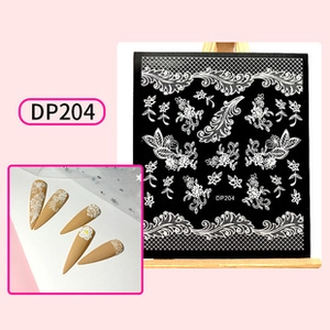 Detailed view of DP204 water transfer nail decals featuring white lace floral patterns