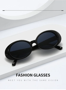 Detail of retro oval sunglasses with black resin frame on minimalist white display stand