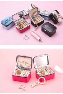 Detail of portable jewelry box with interior mirror and velvet storage compartments