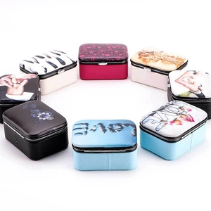Portable travel jewelry organizer with colorful heart patterns for rings and earrings