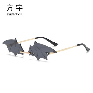 Creative bat-shaped rimless sunglasses with dark grey wings and gold metal temples