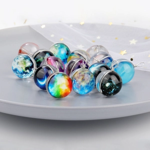 Luminous galaxy glass ball pendants with nebula patterns and metal wire hooks
