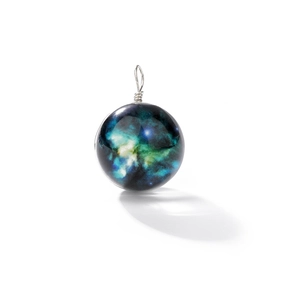 Detail of galaxy glass pendant with nebula pattern and silver wire wrapping decor