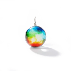 Macro detail of cosmic nebula glass sphere pendant with silver wire wrap bail