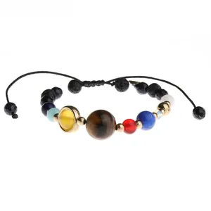 Solar system themed bracelet with tiger eye and lava stone beads on white background