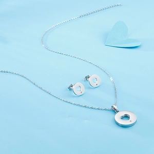 Silver stainless steel jewelry set featuring hollow heart pendant necklace and stud earrings