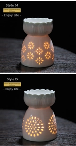 Close-up of hollowed-out lotus flower ceramic oil burners with warm glowing light
