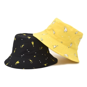 Minimalist cotton bucket hat with cartoon swan prints in black and yellow color options