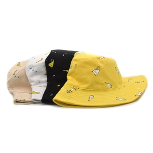 Detail of assorted cotton bucket hats in four colors with playful cartoon ghost prints