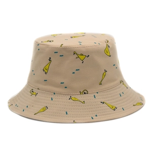 Close-up of beige cotton bucket hat with cute yellow cartoon duck illustration print