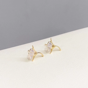 Three pairs of elegant gold fan-shaped stud earrings with sparkling cubic zirconia inlay