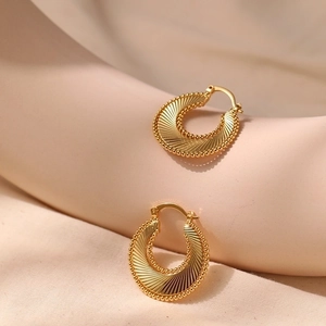 Vintage style gold spiral hoop earrings with radiant texture and 18K gold plated brass finish