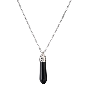 Detailed macro view of black hexagonal stone pendant with silver carved bail on chain