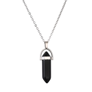 Silver necklace with a hexagonal black crystal stone pendant on a white background