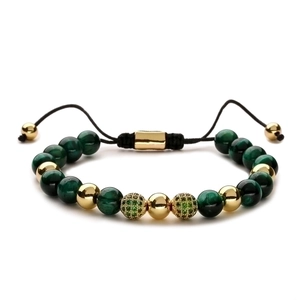 Braided bracelet with 8mm tiger eye beads, gold accents, and green zircon pave balls