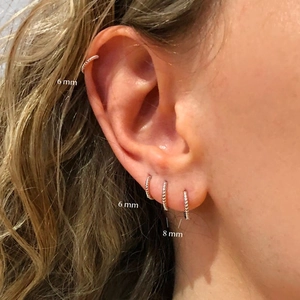 Classic S925 sterling silver twisted hoop earrings in 6mm and 8mm sizes for daily wear
