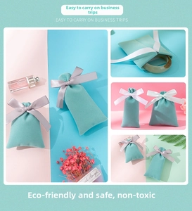 Detail of luxury plush velvet jewelry pouches with silk ribbon bows in Tiffany blue