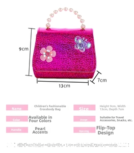 Detail of pink sequin kids bag featuring floral butterfly patches and pearl handle