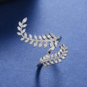 Close-up of olive leaf ring with micro-paved cubic zirconia in silver finish