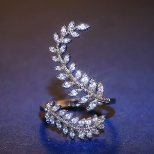 Macro shot of silver olive leaf ring with sparkling marquise cut cubic zirconia stones