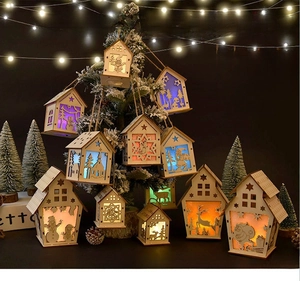 Close-up of laser-cut wooden Christmas ornament with warm LED lights and twine hanger