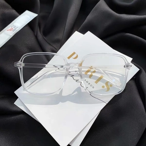Stylish transparent square frame anti-blue light glasses on a black and white background