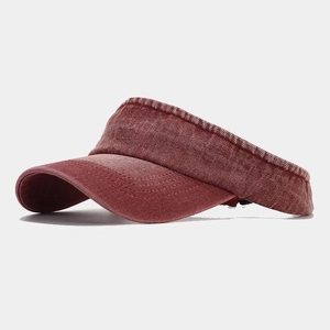 Close-up of wine red denim sun visor showing fabric texture and stitching details