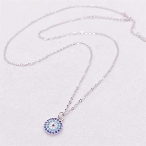 S925 sterling silver evil eye necklace with blue and purple crystals on white surface