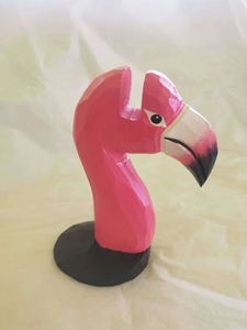 Detail of pink and black geometric flamingo wooden sculpture glasses holder stand