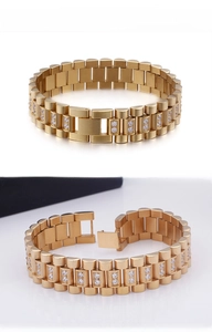 Macro detail of men's gold plated stainless steel bracelet with zircon inlay