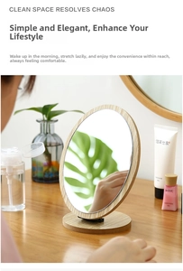 Close-up of a desktop round makeup mirror with a natural wood frame and base