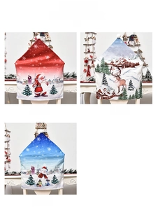 Detail showing Santa, Reindeer, and Snowman prints on festive Christmas chair covers