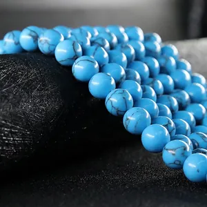 Polished blue turquoise round beads with natural black matrix veins for jewelry making