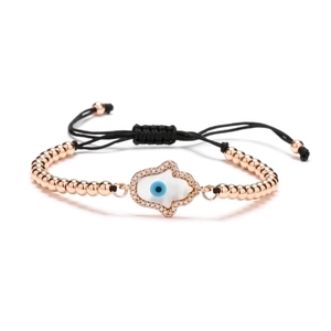 Rose gold Hamsa Hand bracelet with blue Evil Eye and shell inlay on black cord