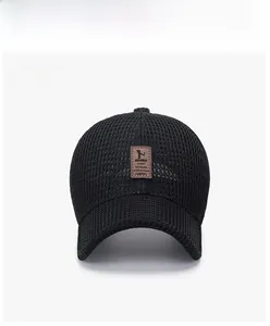 Front view of a breathable black mesh baseball cap with a vintage brown leather patch