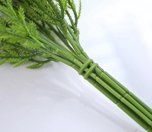 Detailed view of artificial green plant stems with professional branching and bundling