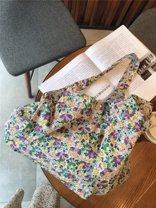 Floral fabric tote bag on wooden table with magazine and coffee in a lifestyle setting