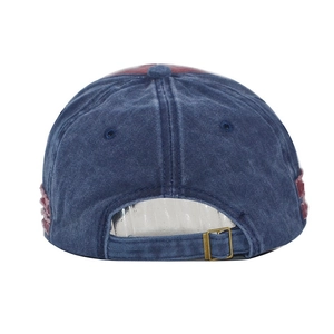 Detail of vintage washed cotton baseball cap with adjustable bronze metal buckle back