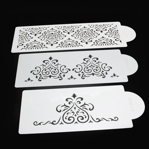 Set of 3 white cake lace stencils with intricate European floral patterns on black background
